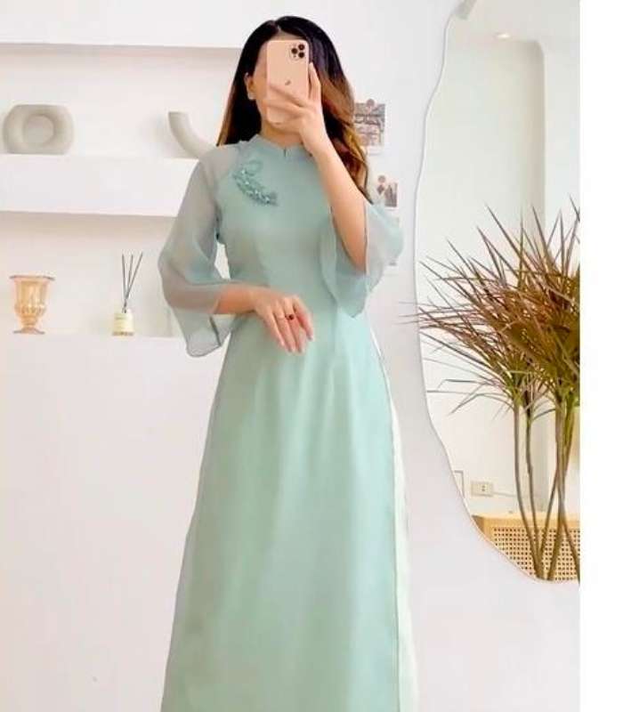 Thiết kế tay loe giúp áo dài Nhà Cái FLY88.COM Xanh Chín, Uy Tín Tặng 188k Trang Chủ Fly88.Com Uy Tín Đẳng Cấp Số 1 Châu Á đẹp và duyên dáng hơn